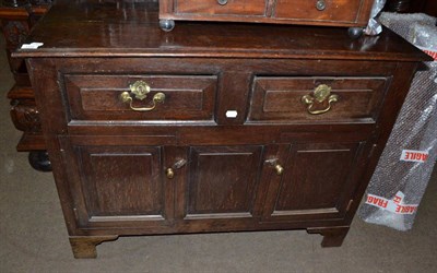 Lot 1519 - An English 18th century oak dresser fitted with two drawers and two cupboard doors