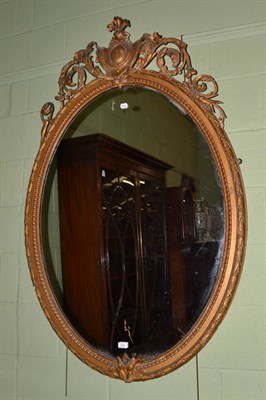 Lot 1530 - Victorian gilt and gesso oval wall mirror, 148cm high