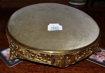 Lot 1543 - A Victorian gilt metal footstool, with stamped Regis traction diamond