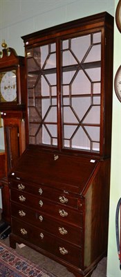 Lot 1553 - A George III mahogany bureau bookcase