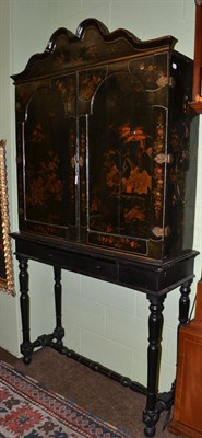 Lot 1561 - A George II japanned cabinet on later stand, 110cm by 38cm by 204cm  Provenance: Ex-Renishaw Hall