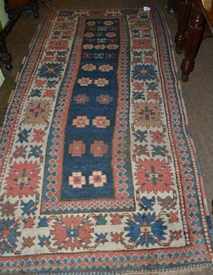 Lot 1562 - Kazak runner, central Caucasus, the deep indigo field with columns of stylised flowerheads enclosed