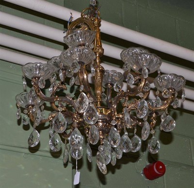 Lot 1571 - A brass eight branch chandelier with cut glass drops (ex Trawsgoed Mansion)