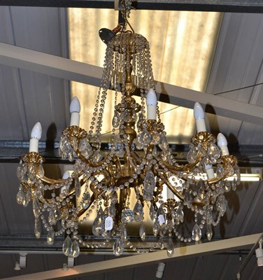 Lot 1574 - A gilt metal ten branch chandelier with cut glass drops (ex Trawsgoed Mansion)