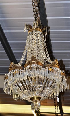 Lot 1576 - A cut glass and gilt metal tiered light fitment (ex Trawsgoed Mansion)