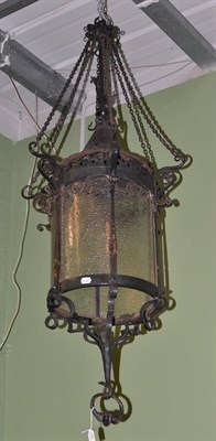 Lot 1580 - Black wrought iron hanging lantern with glazed panels