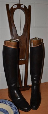 Lot 1599 - A pair of leather riding boots and trees; and a boot jack