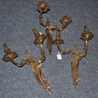 Lot 1605 - Set of three gilt metal two-branch wall lights