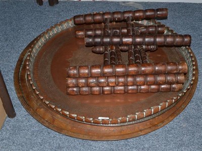 Lot 1614 - Three Eastern copper trays and a folding stand