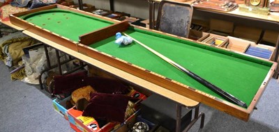 Lot 1616 - ;Bagatelle; folding mahogany billiards table, including balls and side peg score system