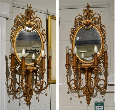 Lot 1626 - A pair of late 19th century gilt and gesso four branch girandoles