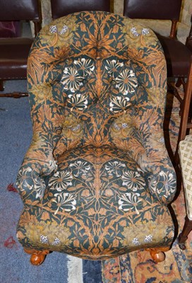 Lot 1674 - Victorian button back armchair raised on short cabriole legs on castors