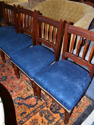 Lot 1678 - A set of four late Victorian walnut dining chairs with overstuffed seats