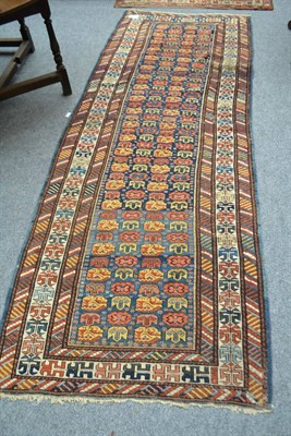 Lot 1681 - Kuba runner, North East Caucasus, the indigo field of polychrome heraldic motifs enclosed by...