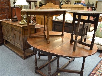 Lot 1692 - An oak gateleg table, an oak sideboard fitted with three cupboard doors, circular top table and...