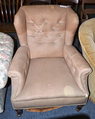 Lot 1697 - A Late Victorian button backed wing armchair