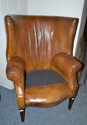 Lot 1721 - 19th century mahogany framed leather upholstered wing/bow armchair lacking squab cushion