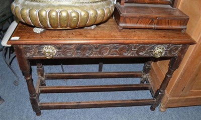 Lot 1724 - A 19th century carved oak side table with single drawer