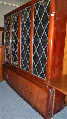 Lot 1748 - A mahogany four door bookcase with leaded glass doors