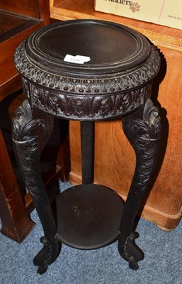 Lot 1759 - An Indian ebonised torchere