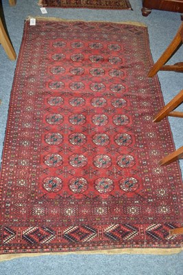 Lot 1772 - Tekke rug, North West Afghanistan, the madder field with four rows of quartered guls enclosed...