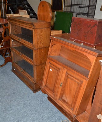 Lot 1782 - An oak three section glazed bookcase and an Edwardian walnut hanging cabinet