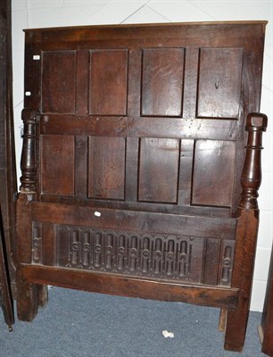 Lot 1787 - An 18th century and later panelled oak bed