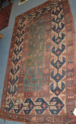 Lot 1792 - A 19th century Kazak rug, Central Caucasus, the apple green field with boteh and stylised...