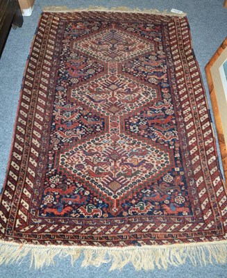 Lot 1793 - Kamseh rug, South West Persia, the field of stylised chickens around three ivory stepped...