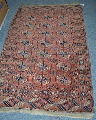 Lot 1797 - Late 19th century Tekke rug, Emirate of Bukhara, the madder field with three columns of...