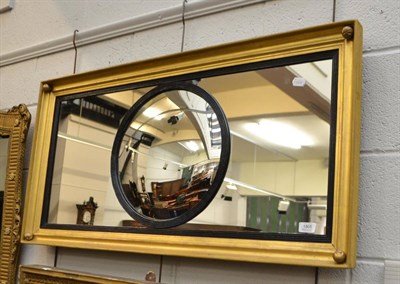 Lot 1805 - A gilt rectangular mirror with convex centre