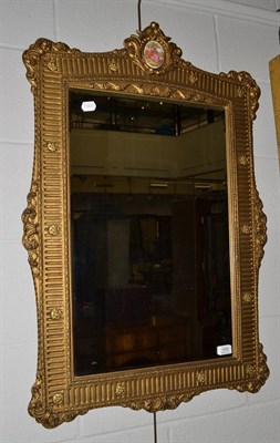 Lot 1806 - A gilt mirror with fluted frame