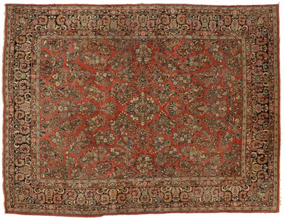 Lot 1819 - Saroukh carpet, West Persia, the crimson field with floral sprays enclosed by palmette and...