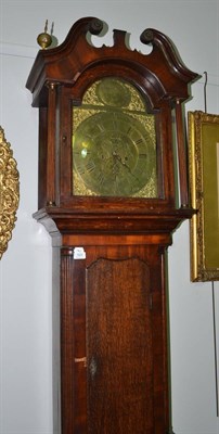 Lot 1824 - An oak eight day longcase clock, swan neck pediment, 12-inch arched brass dial, plaque bearing...