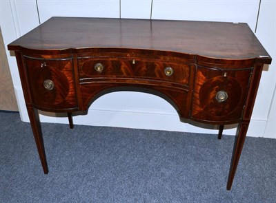 Lot 1830 - A George III mahogany serpentine shaped sideboard