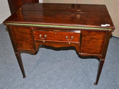 Lot 1831 - Mahogany fold-over games table with a drinks cabinet to one end and three storage drawers,...