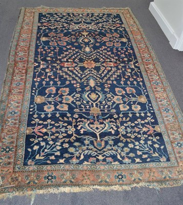 Lot 1844 - Saroukh rug, West Persia, the deep indigo field of angular vines enclosed by flowerhead...