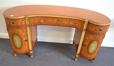 Lot 1848 - A satinwood and polychrome decorated kidney shaped desk