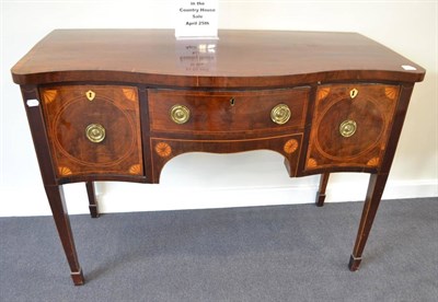 Lot 1851 - A George III mahogany serpentine shaped sideboard