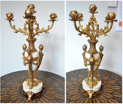 Lot 1871 - A pair of gilt metal four branch candelabra with caryatid mounts