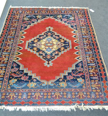 Lot 1873 - Derbend rug, East Caucasus, the tomato field centred by stepped medallions framed by spandrels...