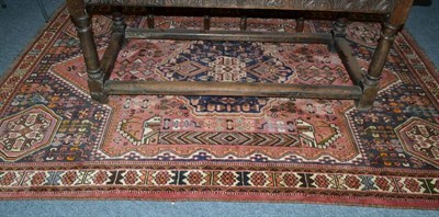 Lot 1882 - Kashgai rug, South West Persia, the faded rose pink field centred by an indigo stepped...