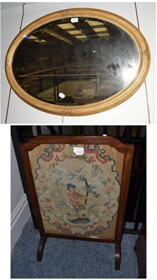 Lot 1883 - 19th century gilt framed oval mirror with bevelled glass plate, 86cm wide and a mahogany firescreen