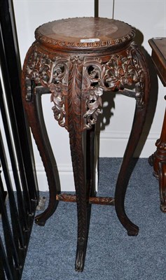 Lot 1884 - A carved Chinese hardwood jardiniere stand