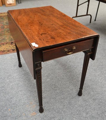 Lot 1888 - A drop leaf table with carved legs