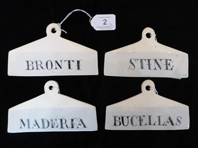 Lot 2 - A set of four 19th century creamware bin labels, inscribed for STINE, BRONTI, BUCELLAS &...