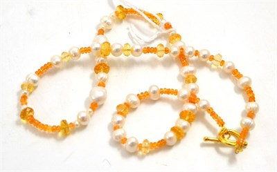 Lot 23 - A garnet, citrine and cultured pearl necklace, faceted mandarin garnet, faceted citrine and...
