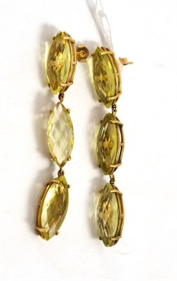 Lot 30 - A pair of 9ct gold citrine drop earrings, each comprising three greeny-yellow marquise shaped...