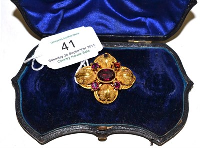 Lot 41 - A Victorian brooch, the quatrefoil form with rope twist and granulation decoration, set with...