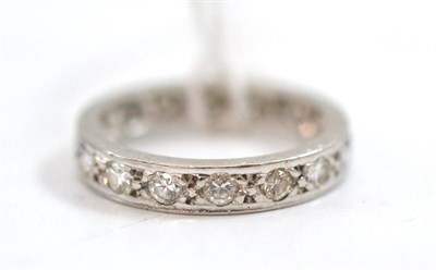 Lot 43 - A diamond eternity ring, round brilliant cut diamonds in white claw settings, with engraved...